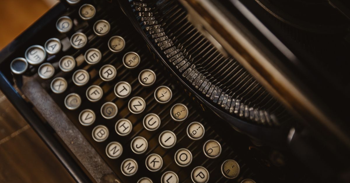 Detailed close-up of vintage typewriter with round keys, showcasing retro design.